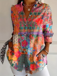 Detail of colorful ethnic print long sleeve shirt with vintage button closure and vibrant patterns