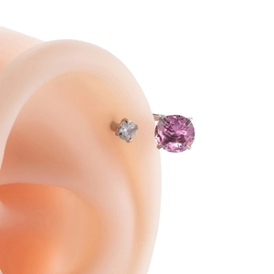 Titanium steel horseshoe ear stud with pink and clear cubic zirconia on silicone model