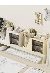 Detail showing multifunctional desk organizer with dual clear drawers and pencil holder