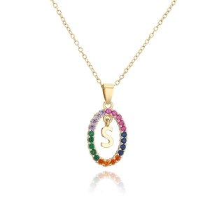 Detail of gold letter S pendant necklace with rainbow cubic zirconia and cable chain