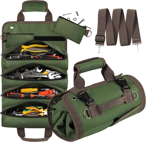 Detail of army green canvas roll-up tool bag with zipper pockets, strap and buckles