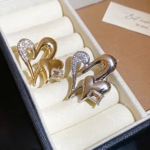 Sparkling diamond heart brooches in gold and silver finish with crystal accents