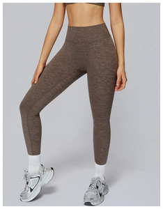 Detail of high waisted brown marl yoga leggings with seamless knit texture for women