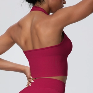 Detail of burgundy seamless yoga set with halter back sports bra and high waist leggings