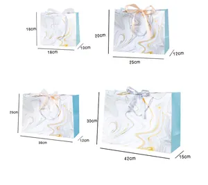 Size chart for marble pattern gift bags with four dimensions and ribbon bow accents