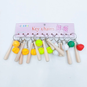 Detailed view of colorful mini baseball and wooden bat keychain sets on display cards