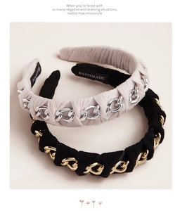 Detail of handmade velvet headbands featuring metallic chunky chains in grey and black