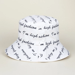 Detail of white cotton bucket hat with high fashion black letter print and fine stitching