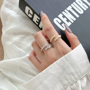 Detailed shot of gold and silver S925 sterling silver open rings with zircon stones