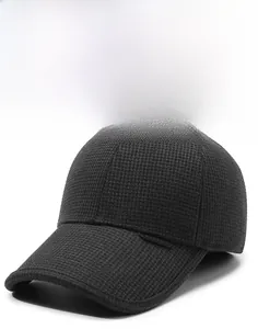 Close-up of winter baseball cap showing thick textured knit fabric and decorative side plate