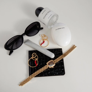 Chic gold hoop earrings with red chili pendants and stylish metal chain wristwatch