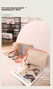 Detail shot of multi-colored woven straw wristlet bags with honeycomb texture