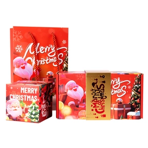 Coffret cadeau surprise de Noël avec emballage festif en papier rouge et doré