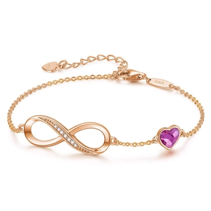 Detail of rose gold S925 silver bracelet with purple heart gem and infinity symbol
