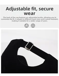 Detail of adjustable metal buckle and fabric strap on a black cotton baseball cap