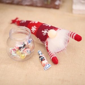 Christmas faceless gnome with snowflake knit hat and white beard on rustic burlap