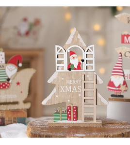 Detail of wooden Christmas tree decor with Santa Claus and Merry Xmas text on wood base