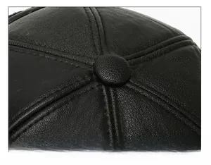 Detail of multi-panel stitched faux leather crown with uniform seams on men's winter hat