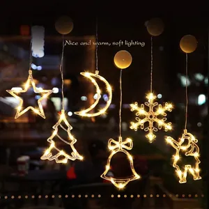 Hanging LED Christmas window lights in star tree and bell shapes with warm glow