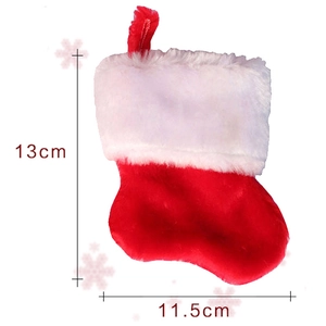 Detailed view of red and white felt Christmas sock showing 13cm x 11.5cm dimensions