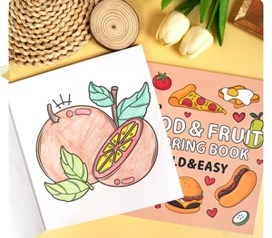 Detail of fruit coloring book showing line art pages and colorful food cover design