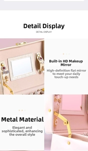 Detail of jewelry box featuring a built-in makeup mirror and gold metal support