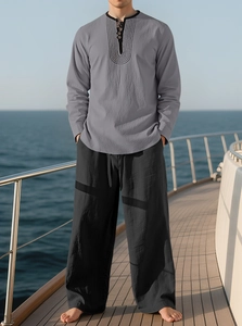 Detail of linen long sleeve shirt and trousers on yacht deck beach vacation style