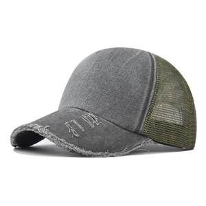Close-up of distressed brim with frayed edges on a vintage wash cotton trucker hat