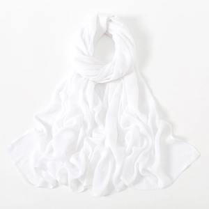 Close-up of pure white modal hijab showing lightweight breathable fabric and fine edge stitching