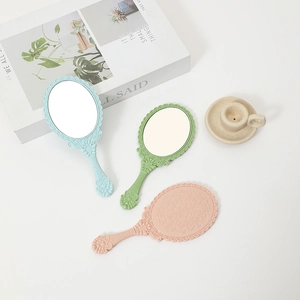 European style floral handheld mirrors in pastel pink, blue, and green colors