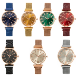 Detail view of colorful Milanese mesh strap watches with Roman numeral and crystal markers