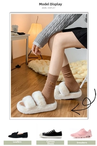 Detail of caramel knit mid-calf socks with gold bow accent and white faux fur slippers