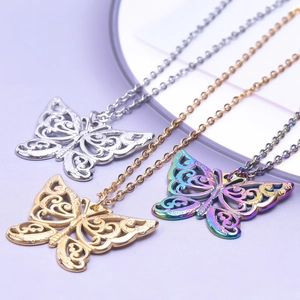 Detailed view of cutout butterfly pendant necklaces in gold, silver, and rainbow colors