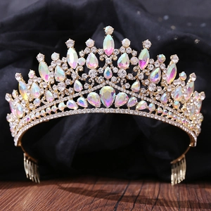Detail of a golden bridal hair comb featuring rainbow rhinestones and crystal accents