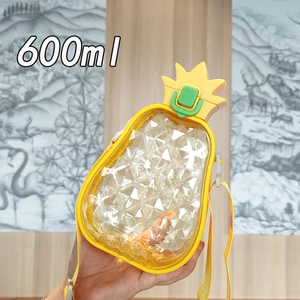 Close-up of a 600ml pineapple shaped water bottle with straw and yellow carry strap