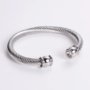 7mm wide silver stainless steel cable twist cuff bracelet featuring a clear zircon stone