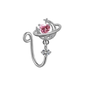 Macro detail of silver heart planet nose clip with pink gem and sparkling crystals