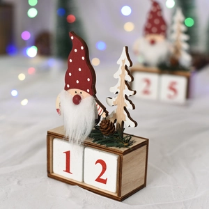 Detail of wooden Christmas gnome countdown calendar with numbered blocks and pine cones