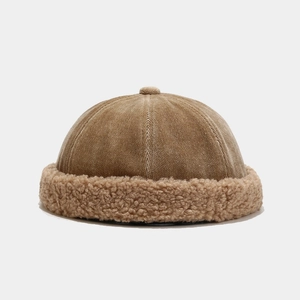 Detail of corduroy texture and plush faux lamb wool brim on vintage khaki miki hat