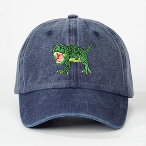 Washed navy cotton baseball cap featuring a green dinosaur embroidery on a white background