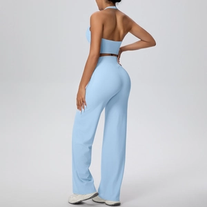 Back view of light blue halter yoga top and high waist wide leg sports trousers