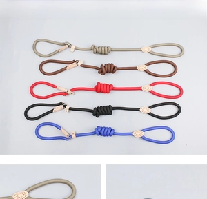 Five colors of durable nylon braided dog leashes with leather joints on grey background