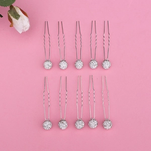 Macro view of 10-piece U-shaped hair pins with sparkling rhinestone balls for bridal hair