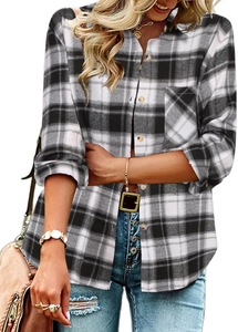 Detail of classic black and white plaid shirt showing long sleeves and single chest pocket