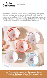Close-up of hand-painted ceramic mugs with floral and heart patterns from a top view