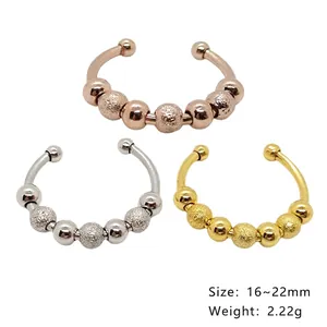 Three-piece stainless steel anxiety relief rings with rotating beads in gold silver and rose gold