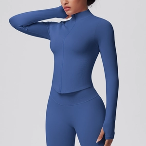 Close-up of blue high-elastic sports jacket showing thumbhole cuffs and rib knit texture