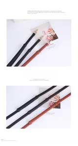 Detail of adjustable litchi grain leather bag straps with light gold metal spring hooks
