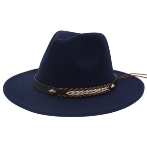 Detailed close-up of dark blue wool fedora with brown braided leather band and metal studs