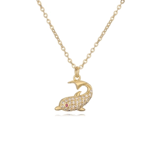 Golden dolphin necklace with sparkling cubic zirconia and pink stone eye on white background